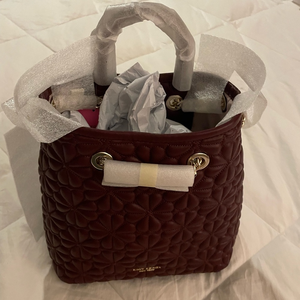 Brand New Kate Spade Handbag, Color is a deep plumb, Bucket shape, about 9x9 1/2